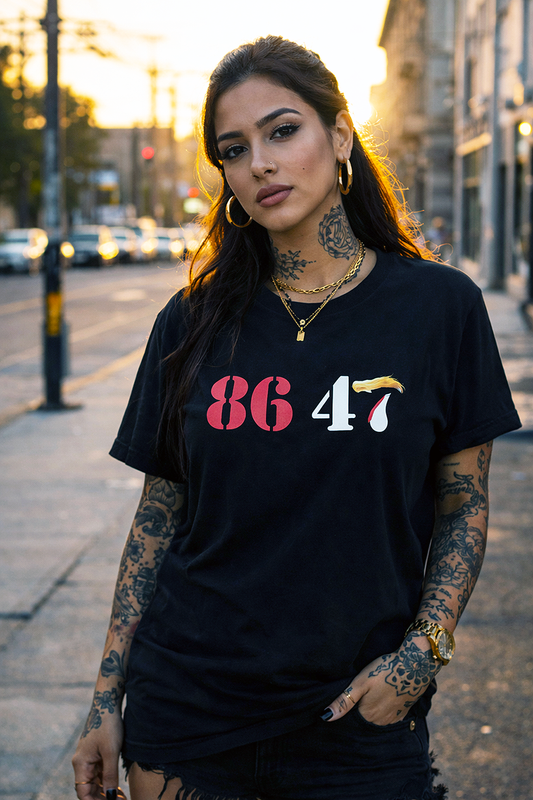 86 47 anti Trump political satire graphic tee worn by tattooed Latina female model on urban street at golden hour black t-shirt