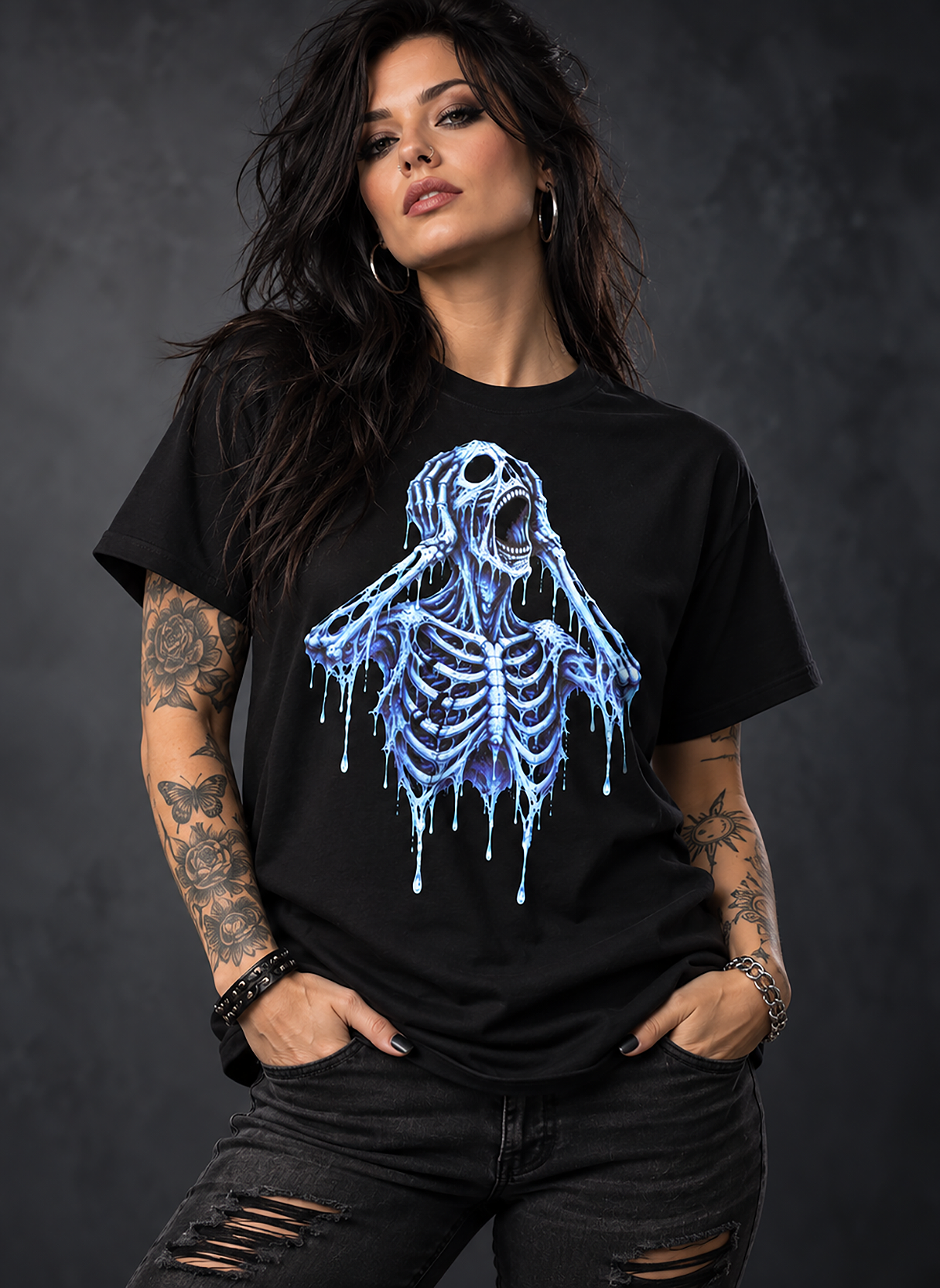 A woman with tattoos wearing a icy scream t-shirt, black graphic tee, screaming skeleton illustration, skull face dripping ice design, horror skeleton graphic print, blue drip skull art, gothic horror streetwear shirt, frozen nightmare graphic, the scream parody pose, unisex crew neck shirt