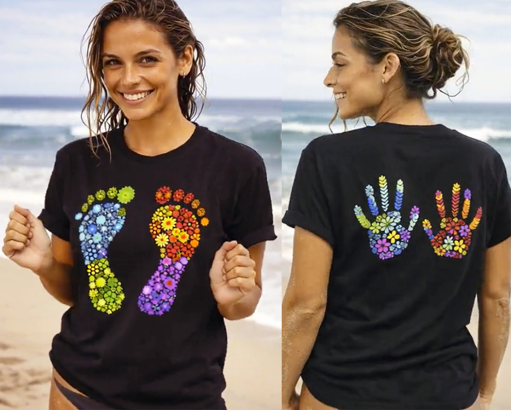 Leave a Mark rainbow floral footprint handprint two-sided tee worn by model beach black t-shirt
