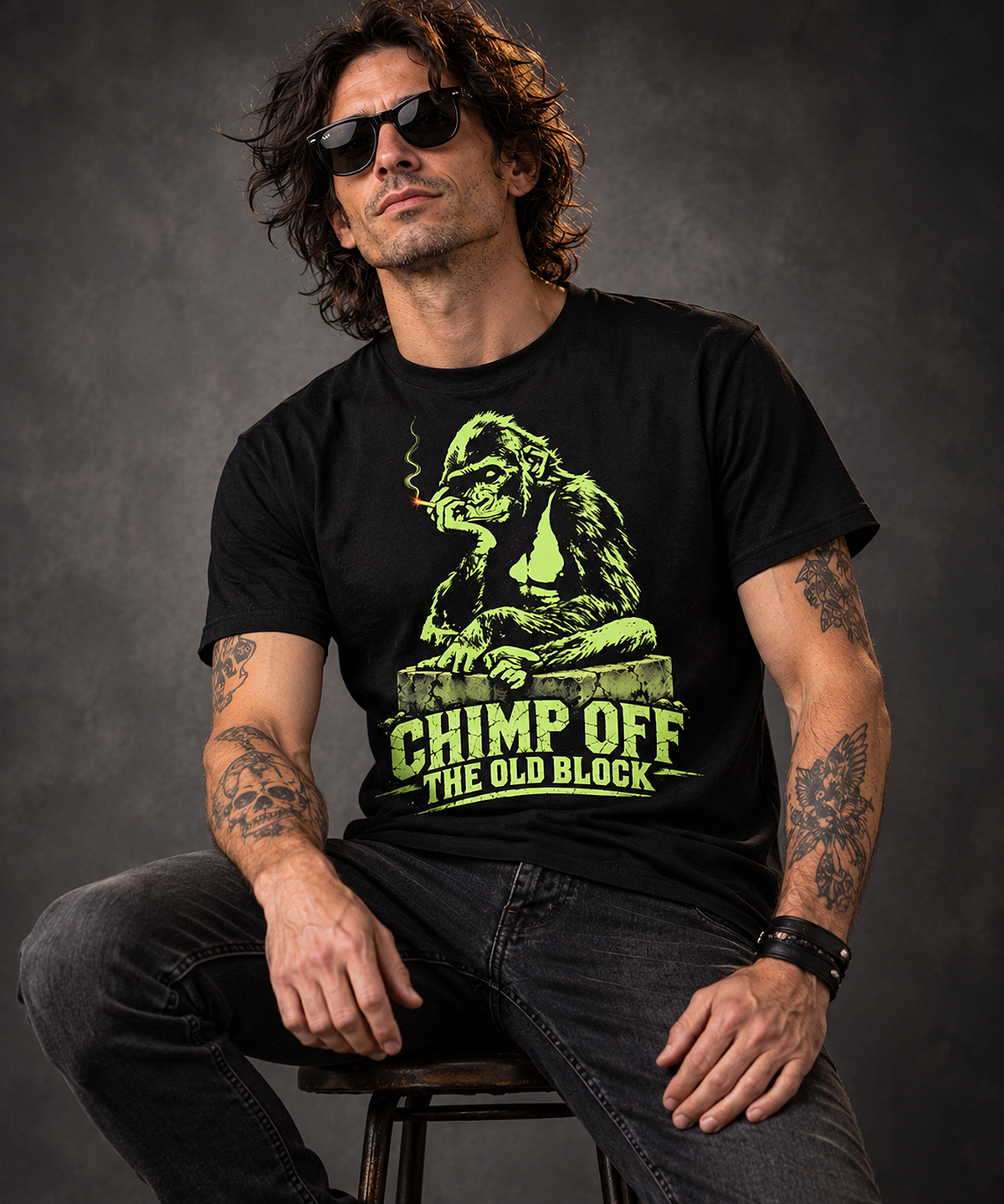 Man wearing a chimp off the old block t-shirt, black graphic tee, neon green gorilla illustration, smoking gorilla graphic design, cracked concrete block art, streetwear gorilla print, funny generational pun shirt, urban jungle style graphic, bold neon print design, unisex crew neck shirt