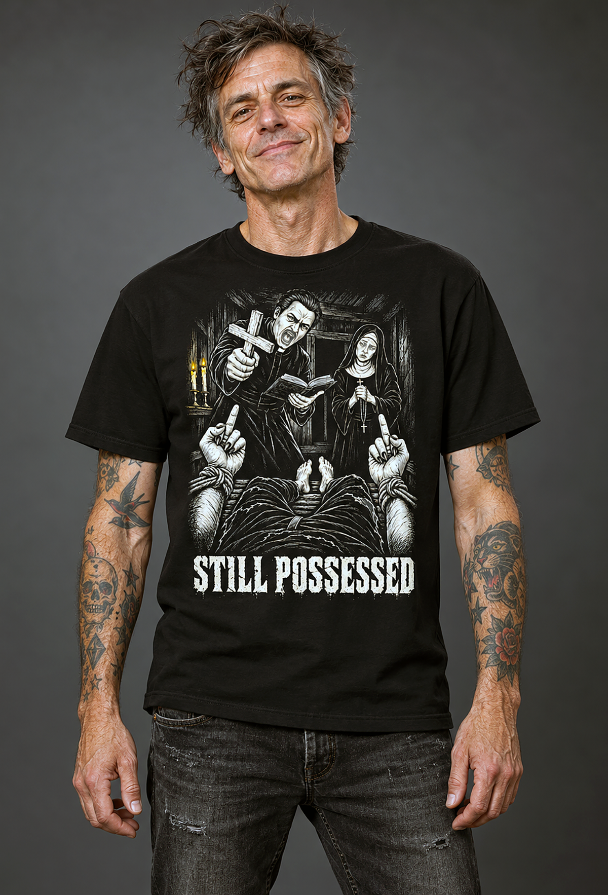 A man with tattoos wearing a still possessed t-shirt, black graphic tee, gothic exorcism illustration, priest and nun horror design, bound demon hands graphic, defiant gesture horror print, candlelit dark scene art, distressed horror typography, black and white horror illustration, unisex crew neck shirt