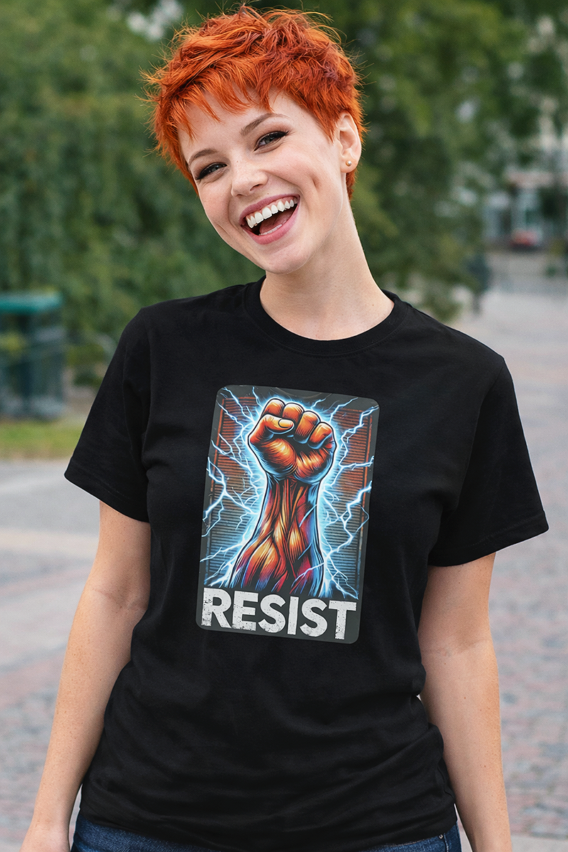 Resist electric fist lightning protest graphic tee worn by red-haired female model laughing in outdoor park black t-shirt