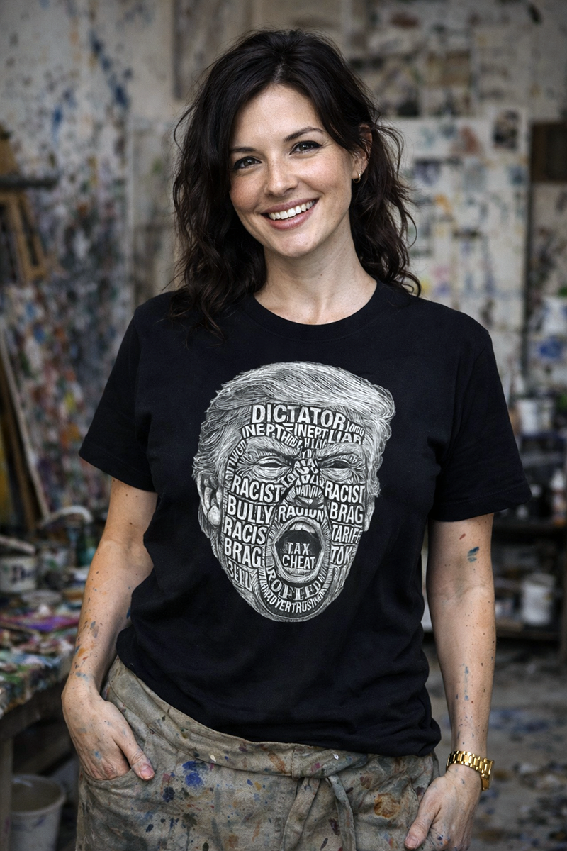 Trump Word Storm political satire typography tee worn by female artist in paint-splattered studio black t-shirt