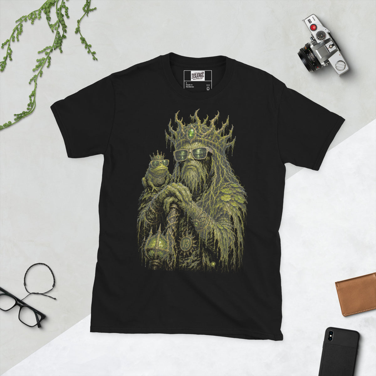 swamp creature t-shirt, black graphic tee, moss covered king illustration, thorned crown design, gnarled staff graphic, crowned frog companion, gothic sunglasses design, halloween monster tee, bog king streetwear tee, unisex crew neck shirt