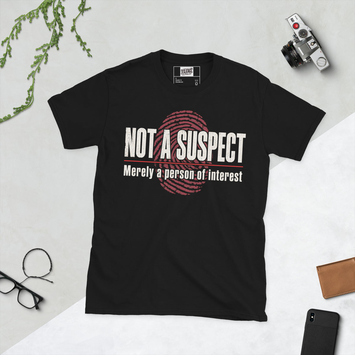 not a suspect t-shirt, black graphic tee, distressed typography design, fingerprint graphic print, true crime humor shirt, sarcastic statement tee, red underline text design, vintage case file aesthetic, ironic quote graphic, unisex crew neck shirt
