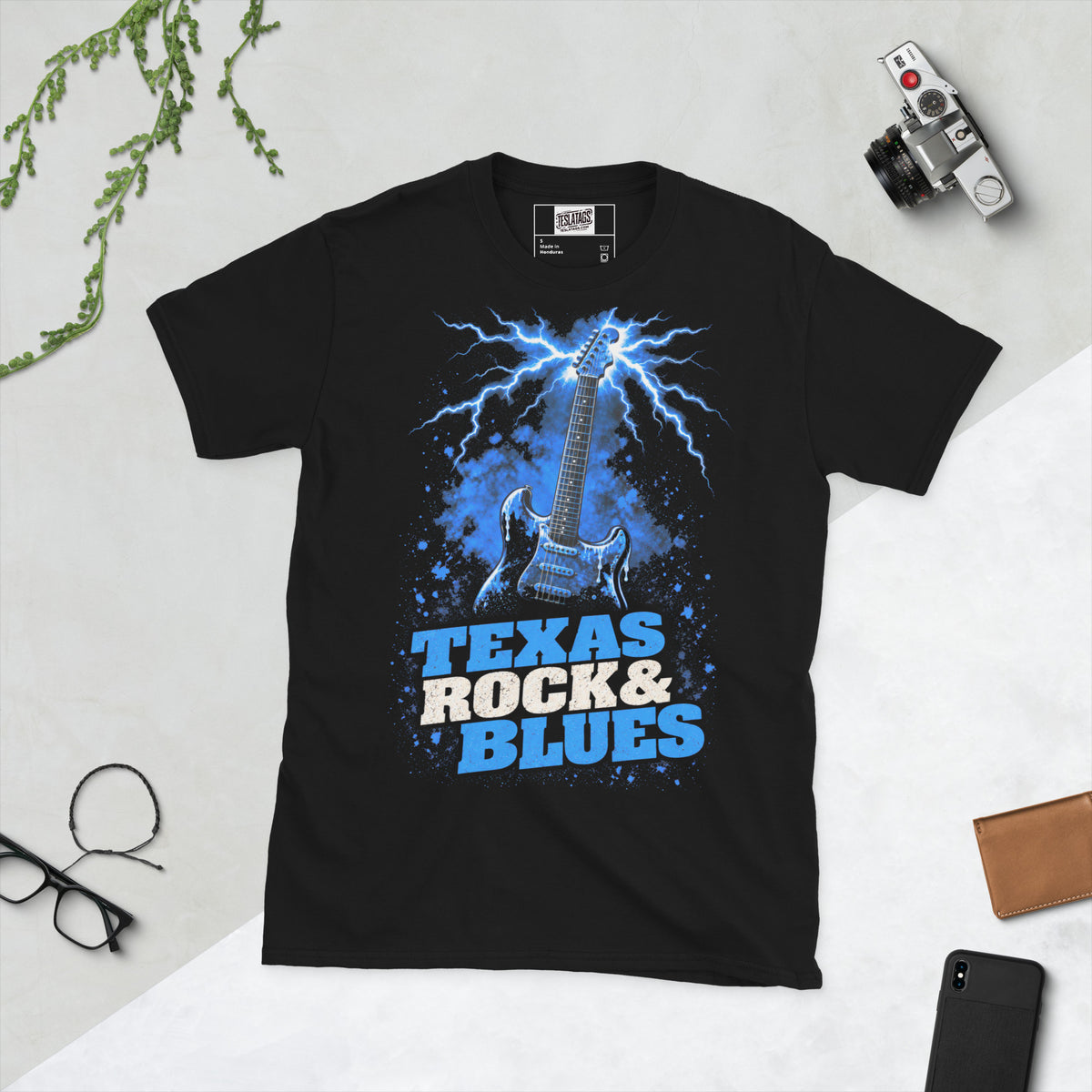 texas rock and blues t-shirt, black graphic tee, electric guitar lightning design, blue lightning storm graphic, paint splatter guitar art, southern rock streetwear shirt, blues rock music graphic, vintage rock poster style, texas music pride design, unisex crew neck shirt