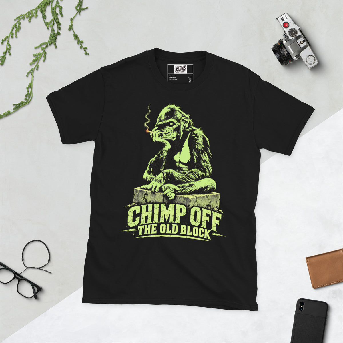 chimp off the old block t-shirt, black graphic tee, neon green gorilla illustration, smoking gorilla graphic design, cracked concrete block art, streetwear gorilla print, funny generational pun shirt, urban jungle style graphic, bold neon print design, unisex crew neck shirt