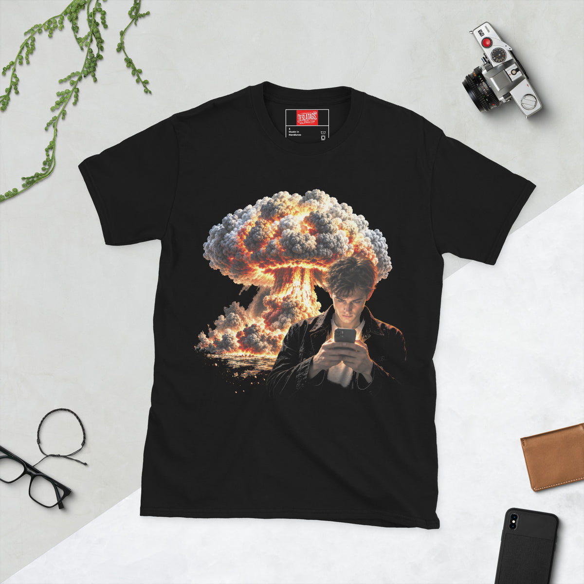 photo bombing t-shirt, black graphic tee, guy on phone illustration, mushroom cloud explosion graphic design, nuclear blast background art, distracted phone humor print, viral photobomb concept shirt, apocalyptic backdrop graphic, unisex crew neck shirt