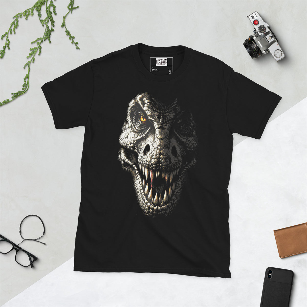 tee rex t-shirt, black graphic tee, realistic t-rex face illustration, dinosaur teeth closeup design, prehistoric predator graphic print, amber eye dinosaur art, dripping blood dinosaur design, hyper-realistic animal print shirt, apex predator streetwear graphic, unisex crew neck shirt
