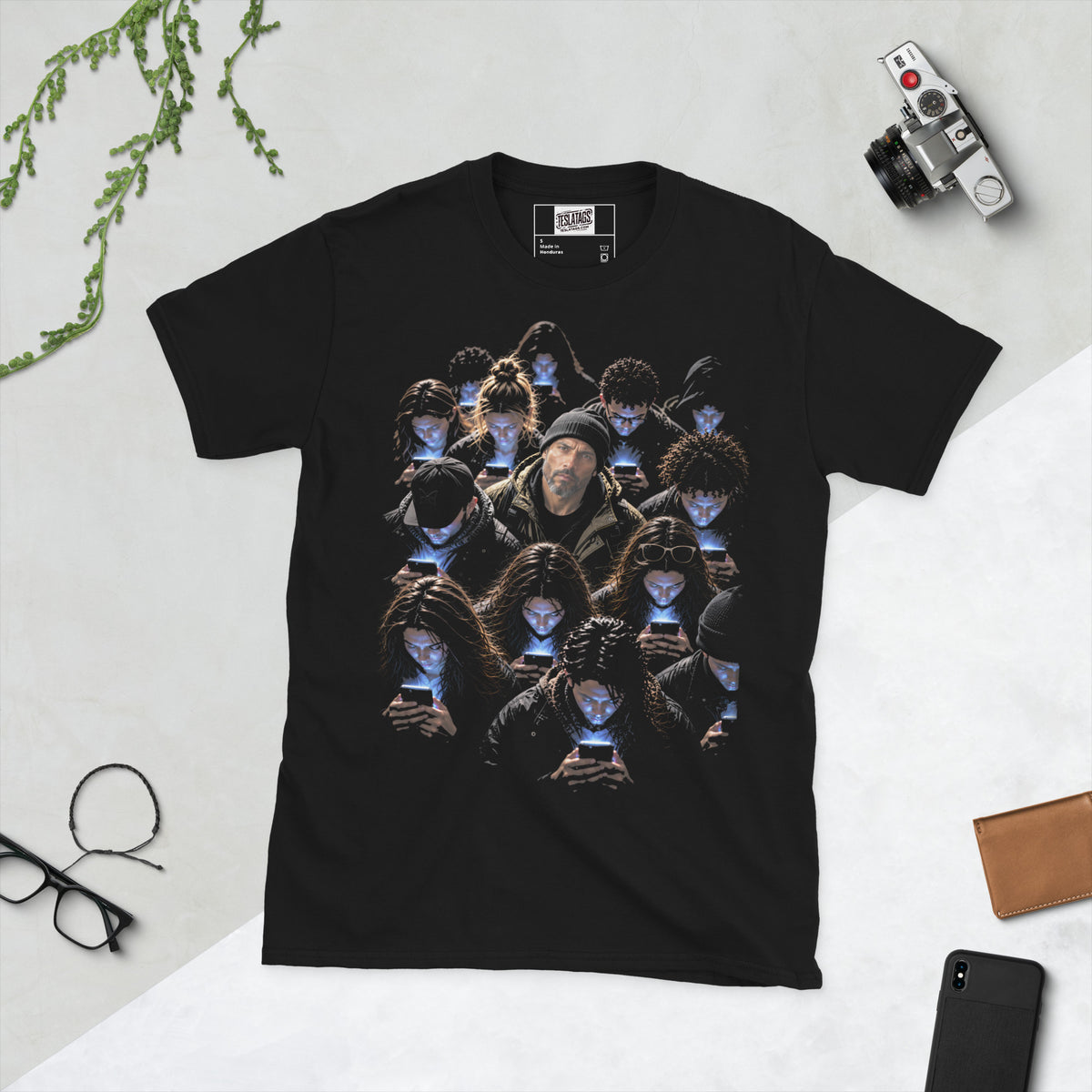 scroll zombies t-shirt, black graphic tee, crowd on phones illustration, glowing phone screen design, one person looking up graphic, zombie crowd portrait art, moody high-contrast print, social commentary streetwear graphic, phone addiction satire design, unisex crew neck shirt