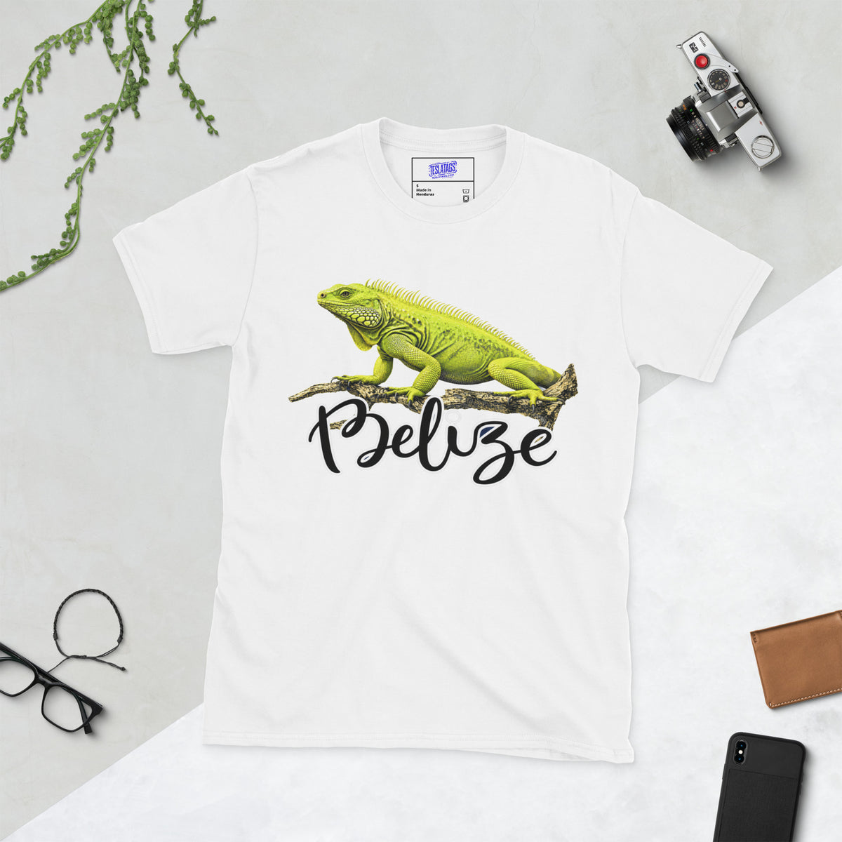 belize t-shirt, green iguana illustration, tropical wildlife graphic, iguana on branch design, hand-lettered script wordmark, reptile lover tee, travel destination shirt, vacation souvenir graphic, nature documentary style print, unisex crew neck shirt, white